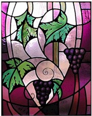 A stained glass window of grape vines